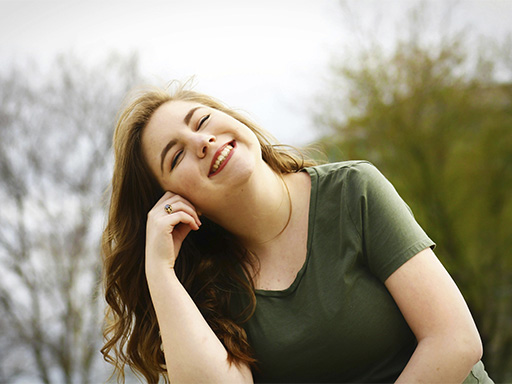 Woman smiling and feeling confident, after starting OCD treatment with a specialist therapist Deerfield, IL.