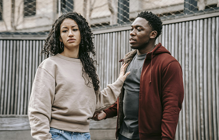 Multiethnic couple having a fight, represents how you can distinguish a toxic relationship from an abusive one.