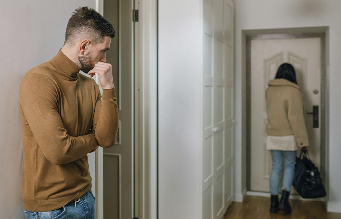 Woman leaving her partner, represents how  you can recognize the signs of a toxic relationship and choose to walk away.