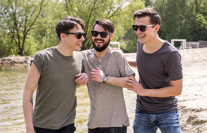 Group of men connecting and laughing together, represents how we can encourage men to open up and move away from the masculinity culture.