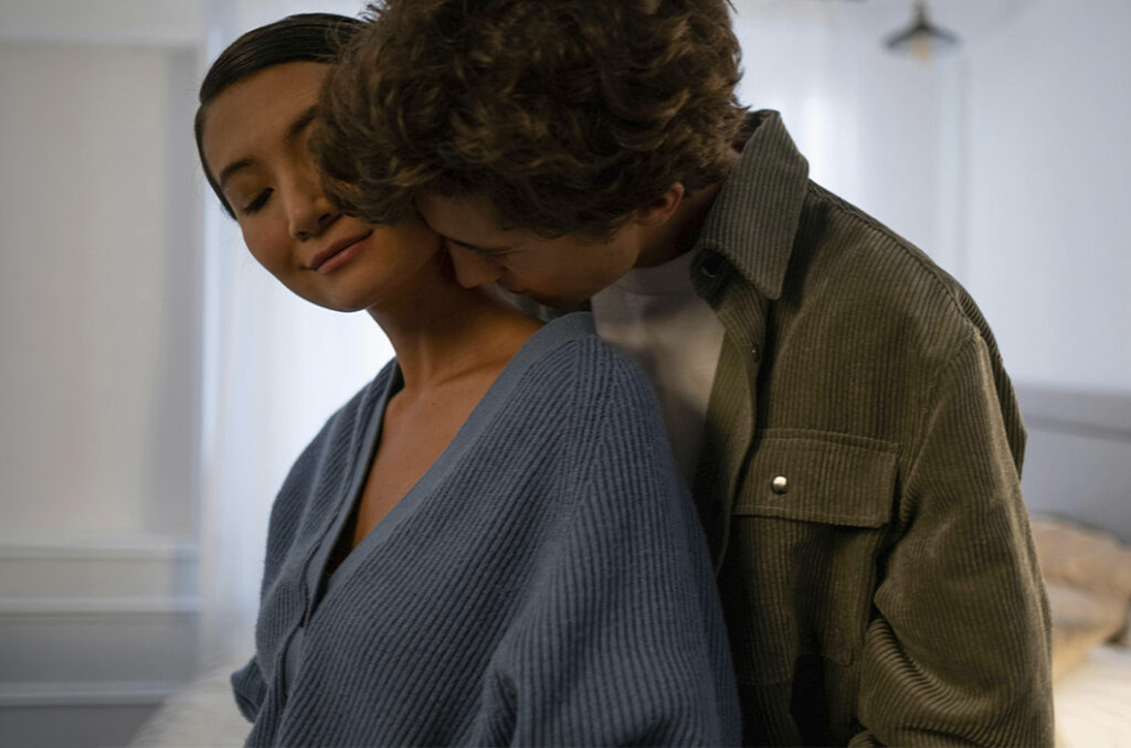 Man hugging his partner in an affectionate moment, represents how relationships can survive cheating with the right support.