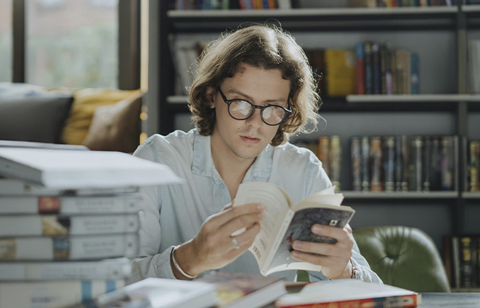 Man reading a book, represents our therapist Bradley C. McGinnis passion for learning and supporting others.