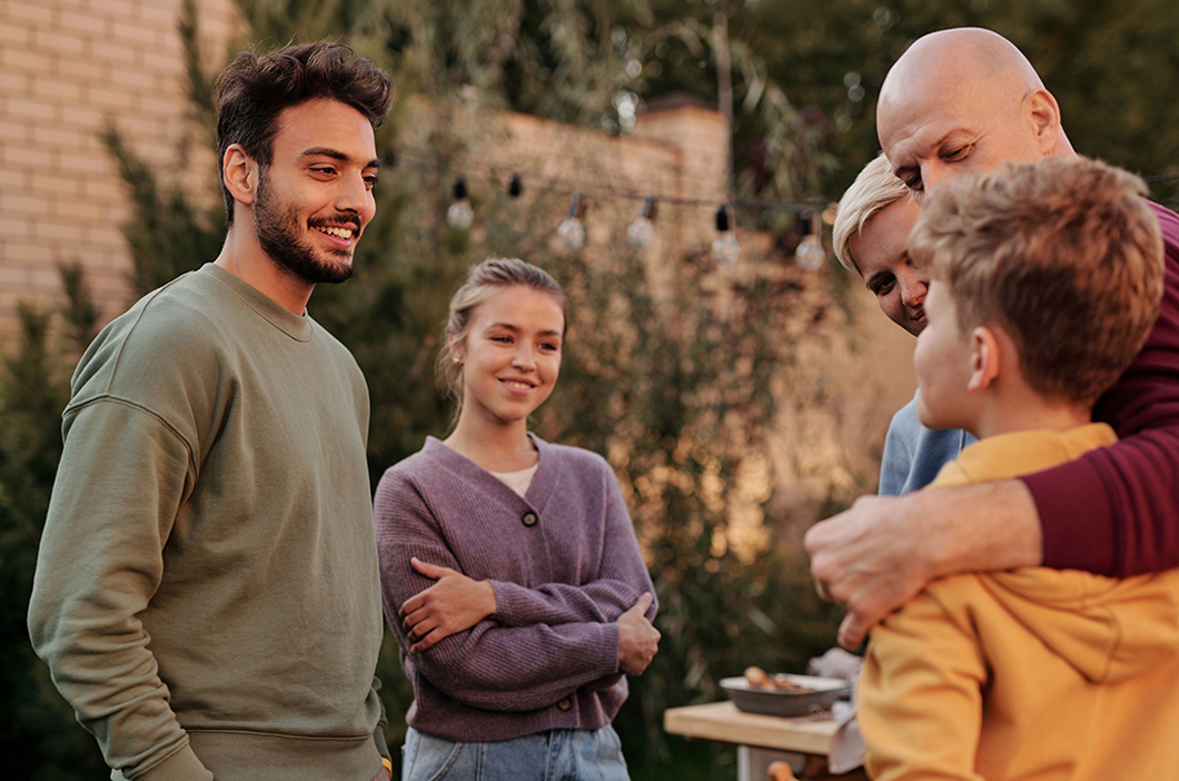 Happy family gathering, represents how setting boundaries with family can help you assert your needs and still improve your relationships.