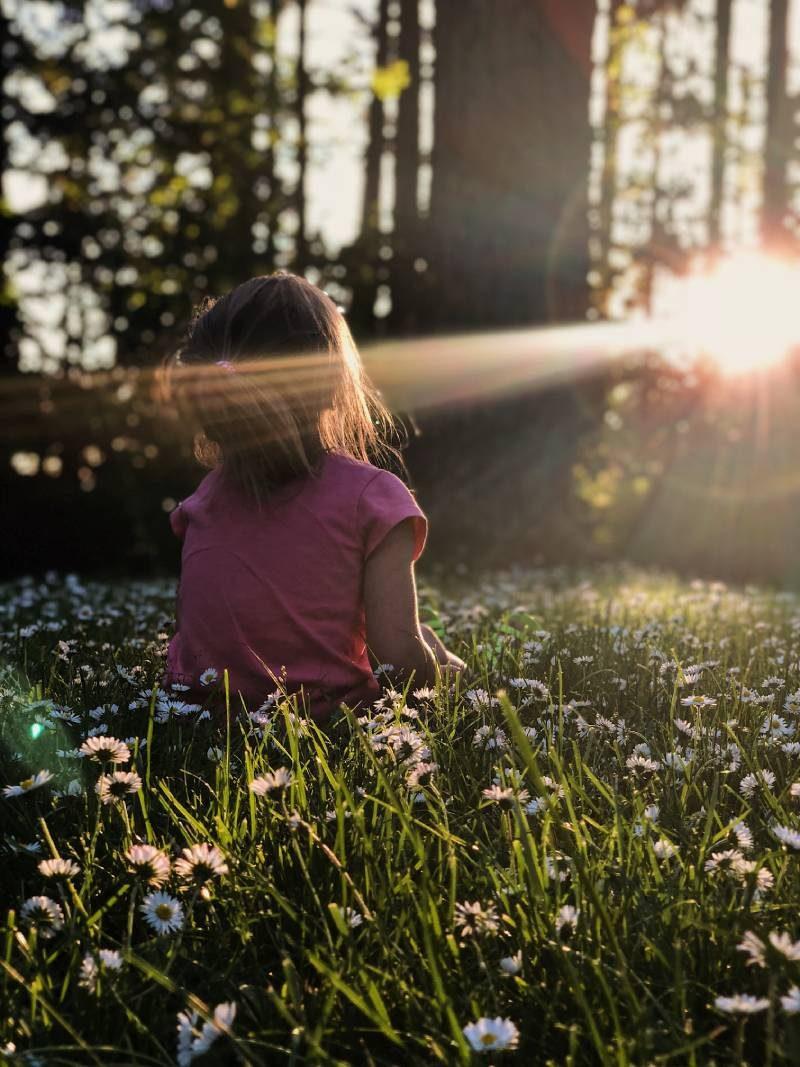 girl meditating in forest